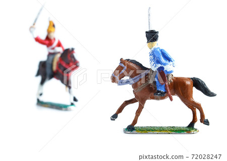 Shot of handmade tin soldiers on horses on the white background 72028247
