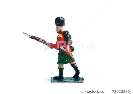Photo of tin soldier's figurine on the white background 72028280