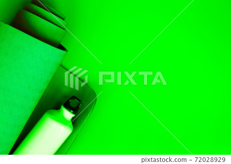 bright green ultramarine yoga mat on a verdant background 72028929