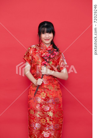 Asian women in red traditional Chinese dress Asian women in red traditional Chinese dress 72029246
