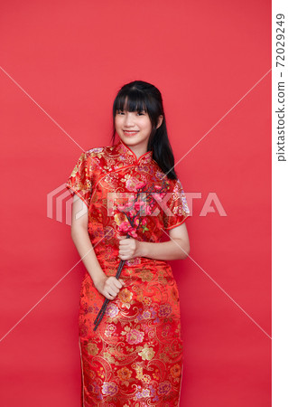 Asian women in red traditional Chinese dress Asian women in red traditional Chinese dress 72029249
