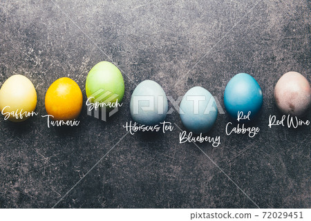 Homemade naturally dyed eggs. 72029451