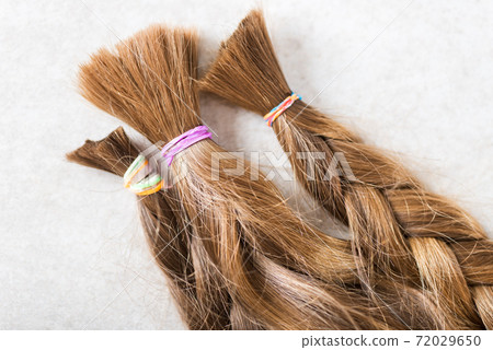 Cut long hair as donation for cancer charity 72029650