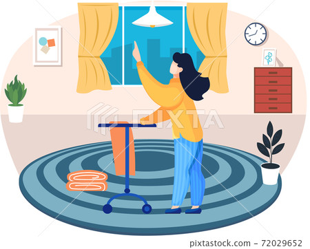 Fashion designer is making a model. Dressmaker is standing near the hanger on wheels and looking up 72029652