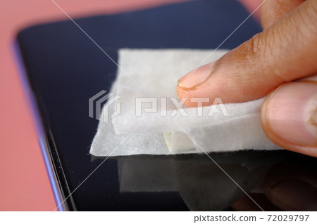 man hand cleaning mobile phone display for preventing virus man hand cleaning mobile phone display for preventing virus 72029797