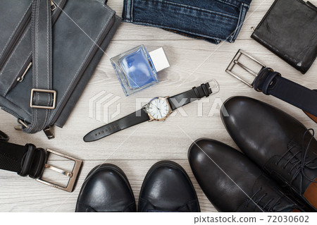 Shoulder bag, two pairs of black leather men's shoes, belts for men, jeans and accessories. Shoulder bag, two pairs of black leather men's shoes, belts for men, jeans and accessories. 72030602