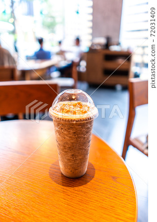 Coffee Frappuccino Blended Beverages served at wood table in shop 72031409