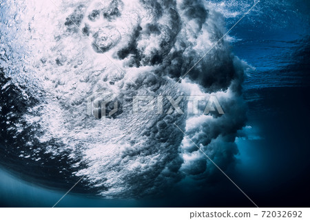 Underwater ocean wave with foam and bubbles. Transparent water and breaking wave Underwater ocean wave with foam and bubbles. Transparent water and breaking wave 72032692