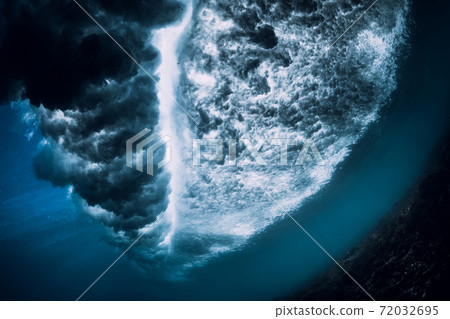 Underwater ocean wave with foam and bubbles. Transparent water and breaking wave Underwater ocean wave with foam and bubbles. Transparent water and breaking wave 72032695