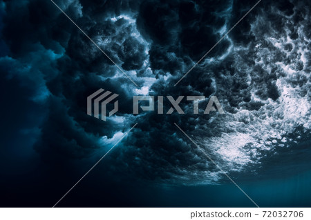 Underwater ocean wave with foam and bubbles. Transparent water and breaking wave Underwater ocean wave with foam and bubbles. Transparent water and breaking wave 72032706