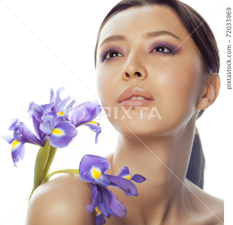 young pretty real asian woman with flower purple orchid isolated on white background spa, healthcare concept young pretty real asian woman with flower purple orchid isolated on white background spa, healthcare concept 72033969