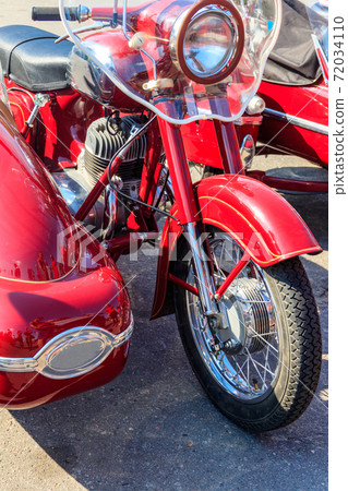 Retro tricar. Three-wheeled motorcycle on city street 72034110