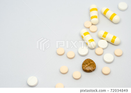 Pill and drug capsule and tablets on white background Pill and drug capsule and tablets on white background 72034849