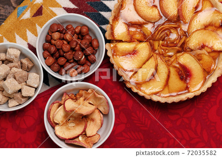 Top view of apple tart pie on tablecloth Top view of apple tart pie on tablecloth 72035582