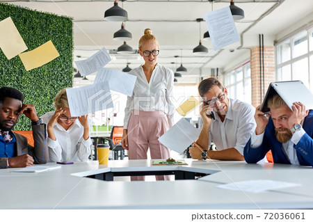 angry unbalanced female boss scream, scolds employees for not fulfilling the plan at work angry unbalanced female boss scream, scolds employees for not fulfilling the plan at work 72036061