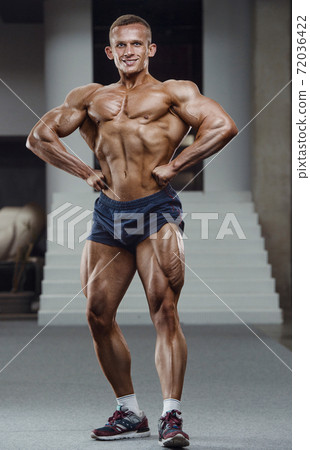 Caucasian man pumping up muscles. fitness training Caucasian man pumping up muscles. fitness training 72036422
