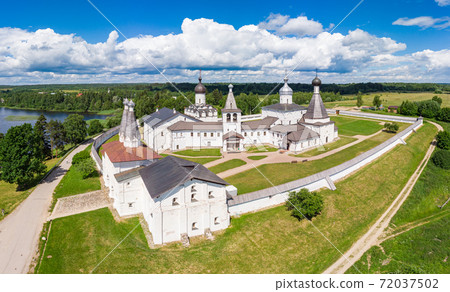 Aerial Panaramic view to Ferapontov Belozersky male monastery of XV century. Complex of temples Located on the shore of the Borodaevsky Lake. Russian Orthodox Church. Kirillov. Vologda Region. Russia Aerial Panaramic view to Ferapontov Belozersky male monastery of XV century. Complex of temples Located on the shore of the Borodaevsky Lake. Russian Orthodox Church. Kirillov. Vologda Region. Russia 72037502