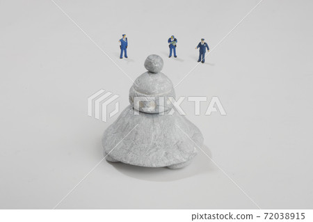 A miniature police officer investigating a landing UFO A miniature police officer investigating a landing UFO 72038915
