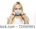 Healthy woman using medical protective mask to health protection 72040901