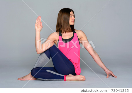 Young pretty woman doing yoga asana Young pretty woman doing yoga asana 72041225