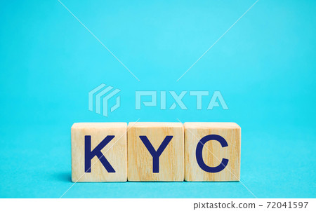 Wooden blocks with the word KYC - Know Your Customer / Client. Verify the identity, suitability and risks involved with maintaining a business relationship. Anti-bribery compliant 72041597