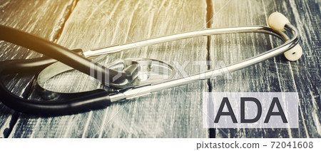 Stethoscope and the inscription ADA - Americans with Disabilities Act. Civil rights law that prohibits discrimination against individuals with disabilities in all areas of public life, jobs, schools 72041608