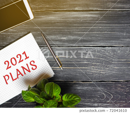 2021 Plans concept. Desktop with notebook, phone, pen. Planning goals, plans and tasks. New business ideas. Setting goal, target. Motivation, inspiration. 2021 Plans concept. Desktop with notebook, phone, pen. Planning goals, plans and tasks. New business ideas. Setting goal, target. Motivation, inspiration. 72041610