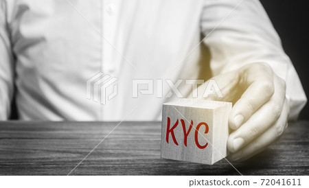 Wooden block with the word KYC - Know Your Customer / Client. Verify the identity, suitability and risks involved with maintaining a business relationship. Anti-bribery compliant Wooden block with the word KYC - Know Your Customer / Client. Verify the identity, suitability and risks involved with maintaining a business relationship. Anti-bribery compliant 72041611