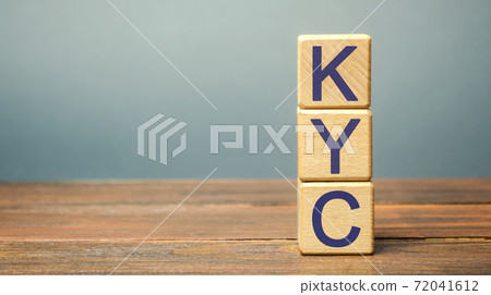 Wooden blocks with the word KYC - Know Your Customer / Client. Verify the identity, suitability and risks involved with maintaining a business relationship. Anti-bribery compliant Wooden blocks with the word KYC - Know Your Customer / Client. Verify the identity, suitability and risks involved with maintaining a business relationship. Anti-bribery compliant 72041612