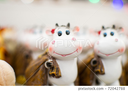 Statuette of Cow or Bull in the supermarket, a symbol of the new year 2021 Statuette of Cow or Bull in the supermarket, a symbol of the new year 2021 72042788