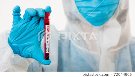 Medical scientist in PPE uniform wear a mask holding test tube Coronavirus Medical scientist in PPE uniform wear a mask holding test tube Coronavirus 72044966