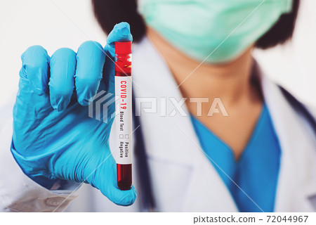 Doctor scientist in white uniform wear a mask holding test tube Coronavirus Doctor scientist in white uniform wear a mask holding test tube Coronavirus 72044967