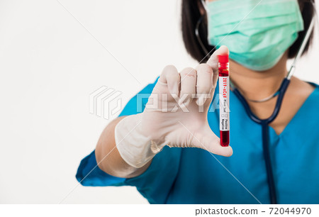 Nurse in blue uniform wear a mask holding test tube sample Coronavirus test blood 72044970