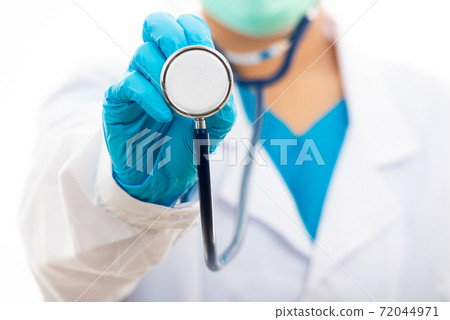 woman doctor in white uniform holding stethoscope 72044971