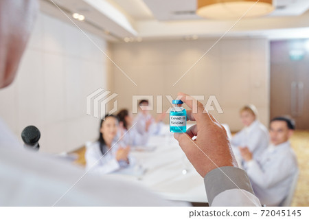 Pharmacologist presenting covid-19 vaccine Pharmacologist presenting covid-19 vaccine 72045145