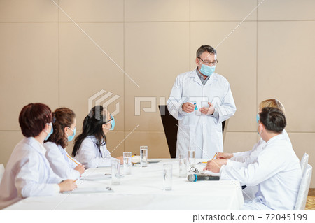 Doctor showing coronavirus vaccine Doctor showing coronavirus vaccine 72045199