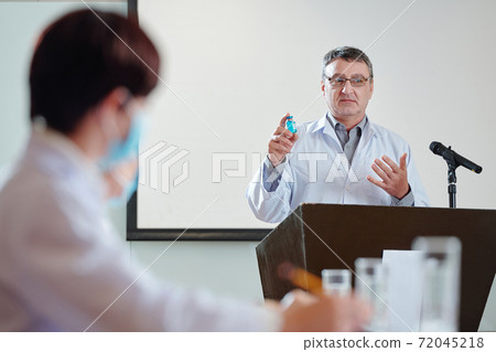 Researcher speaking at conference Researcher speaking at conference 72045218