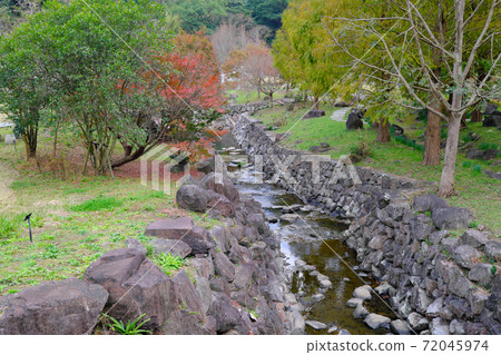 Beautiful stone wall river flowing through Kanmuridakehanagawa Sabo Park Beautiful stone wall river flowing through Kanmuridakehanagawa Sabo Park 72045974