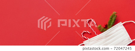 Measures against infectious diseases in winter. Christmas decorations and fir branches and masks Measures against infectious diseases in winter. Christmas decorations and fir branches and masks 72047245