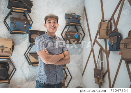 asian male business owner in a bag shop 72047864