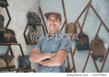 shopkeeper at his bag store shopkeeper at his bag store 72047866
