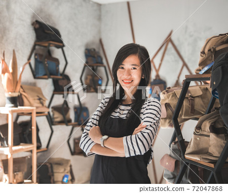 female business owner in a bag shop female business owner in a bag shop 72047868