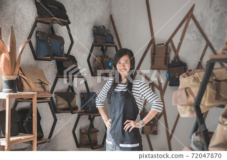 female business owner in a bag shop female business owner in a bag shop 72047870