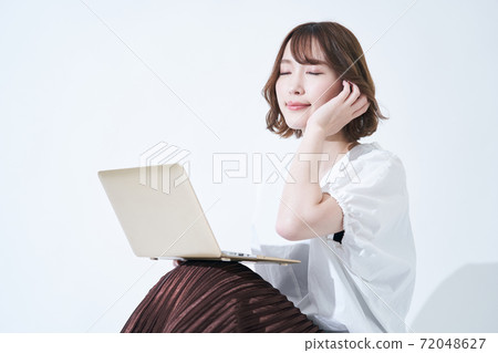 Young woman laptop white background 72048627