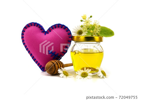 Red fabric heart near linden and chamomile flowers 72049755