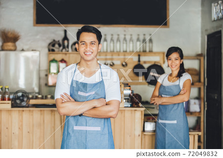 cafe owner standing with crossed arms cafe owner standing with crossed arms 72049832