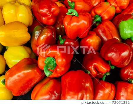 lots of ripe red peppers for cooking as a background 72051221