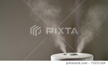 Close-up of steam from an air humidifier in a living room 72052384