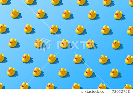 Flat lay of a creative summer yellow rubber duck pattern  72052798