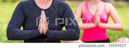 Mature Middle Aged and Young Woman Practicing Yoga Outside Panorama 72054527